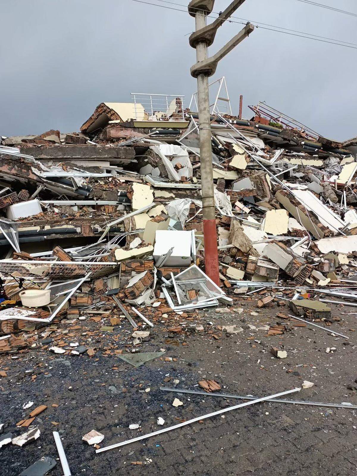 This is what remained of the building the Uluses lived in. In the upper-right quadrant of the photo, note the patio swing and the potted plants.