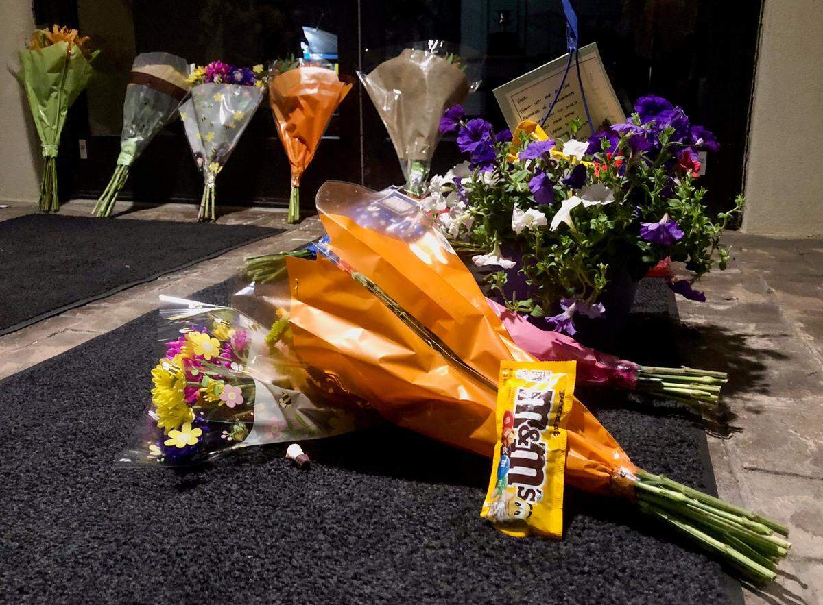 A bag of M&M’s rests with a bouquet of flowers for NASCAR driver Kyle Busch outside of Richard Childress Racing in Welcome, NC. Busch passed away from an illness on Thursday, May 21, 2026.