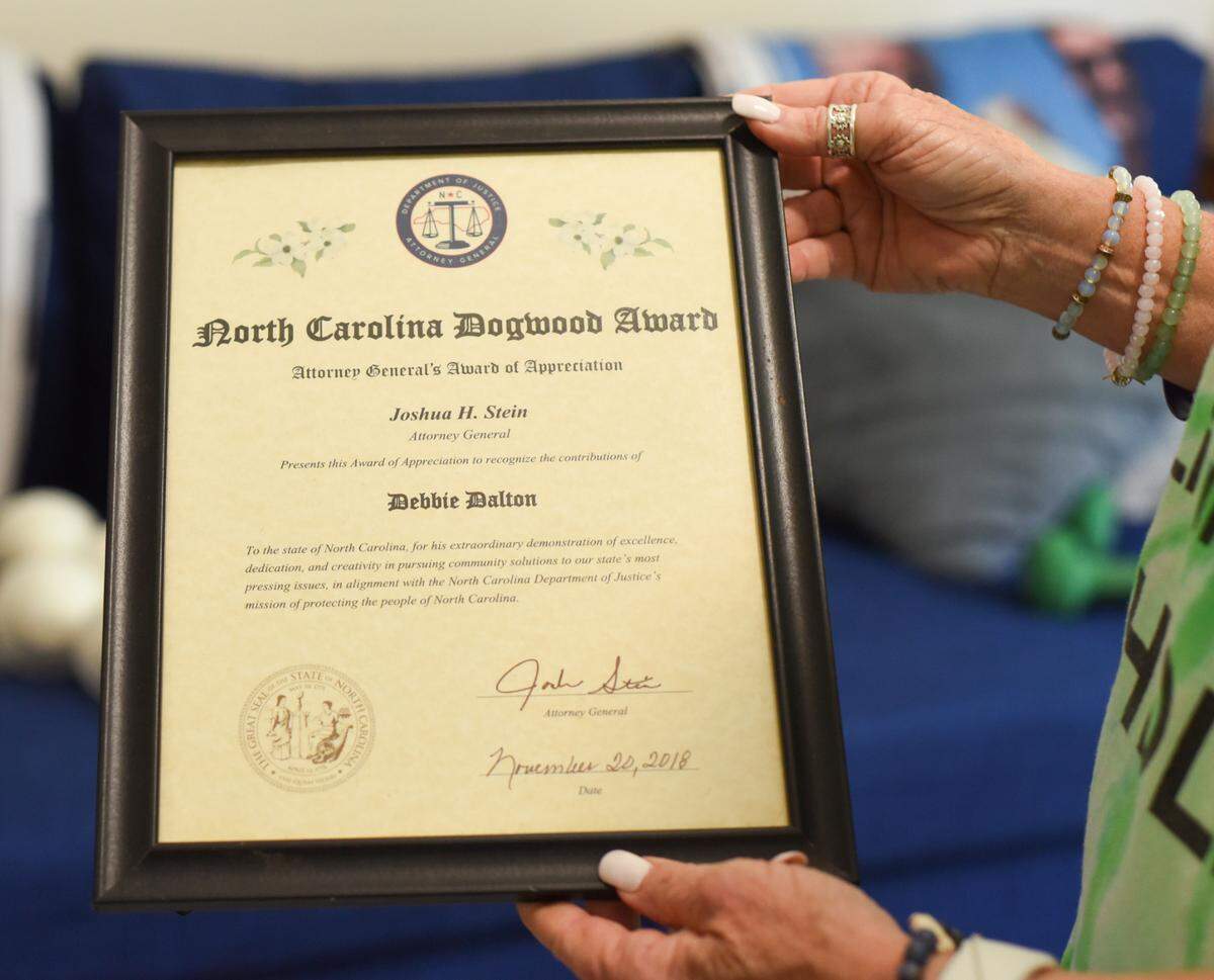 Debbie Dalton holds an award from then-Attorney General Josh Stein, who acknowledged her foundation, the Hunter Dalton #HDLife Foundation, and her dedication to finding solutions to the public health crisis caused by fentanyl.