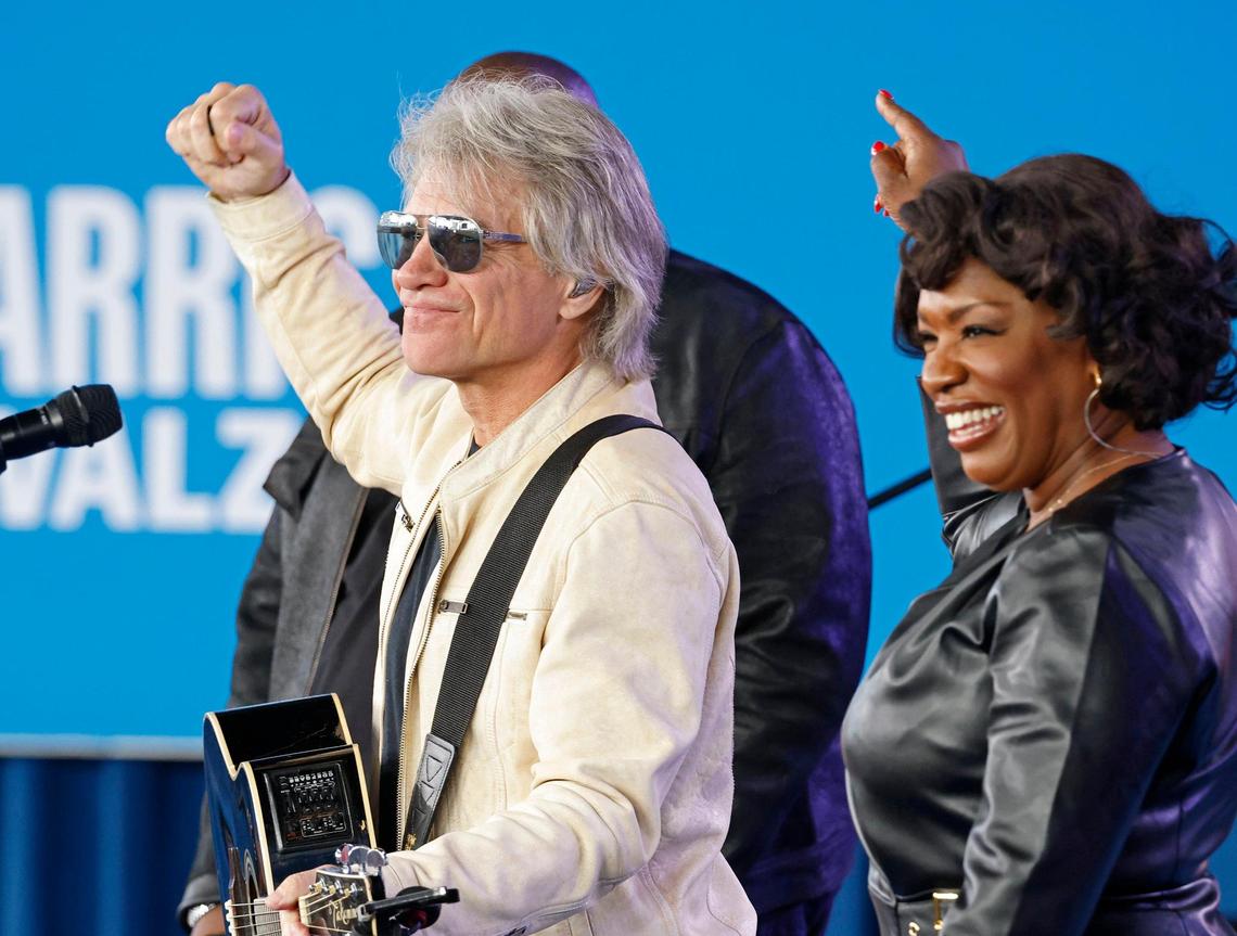 Jon Bon Jovi, left, performs during a rally for presidential candidate and Vice President Kamala Harris at PNC Music Pavilion on Saturday, November 2, 2024.