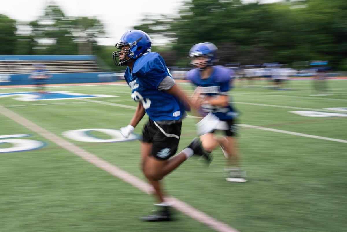 Mooresville High players practice drills at Coach Joe Popp Stadium on July 25, 2024.