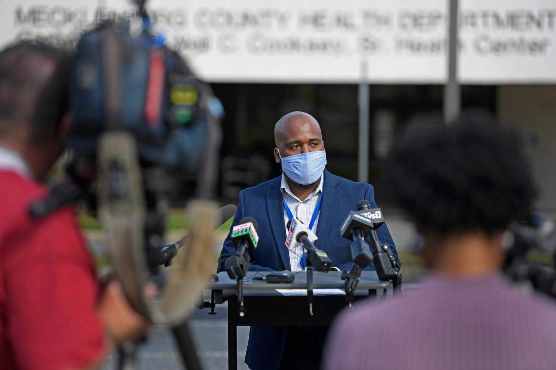 Mecklenburg County Deputy Public Health Director Dr. Raynard Washington talking with reporters about an outbreak connected to United House of Prayer for All People Convocation events. Photo from October 23, 2020.