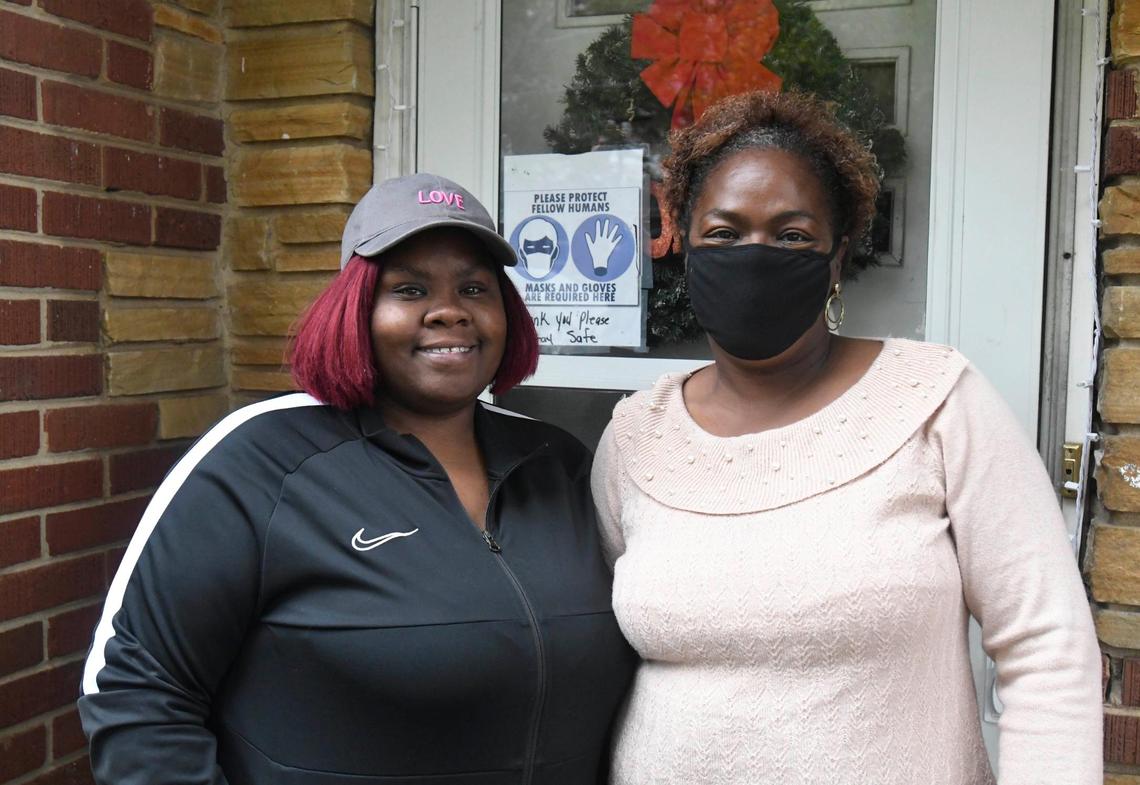 Deborah Gregory, right, with her daughter Dominique Brevard who introduced her to the Loaves & Fishes mobile food pantry at Greater Salem Church, while on porch at home on Wednesday, November 25, 2020.