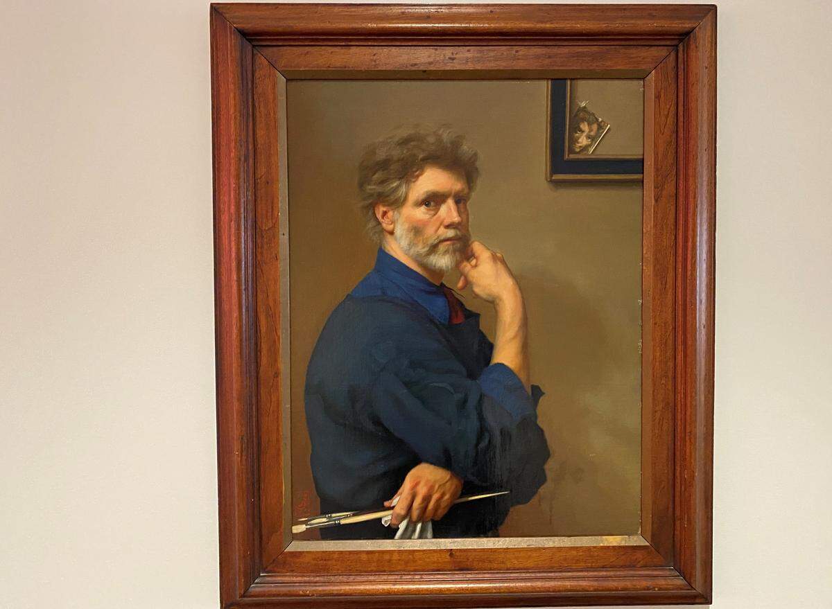A self portrait by renowned North Carolina painter Ben Long hangs in the lobby of the Sarah Belk Gambrell Center for Art and Civic Engagement. It and two other works by Long were gifts to Queens from Betty and Walker Wells.