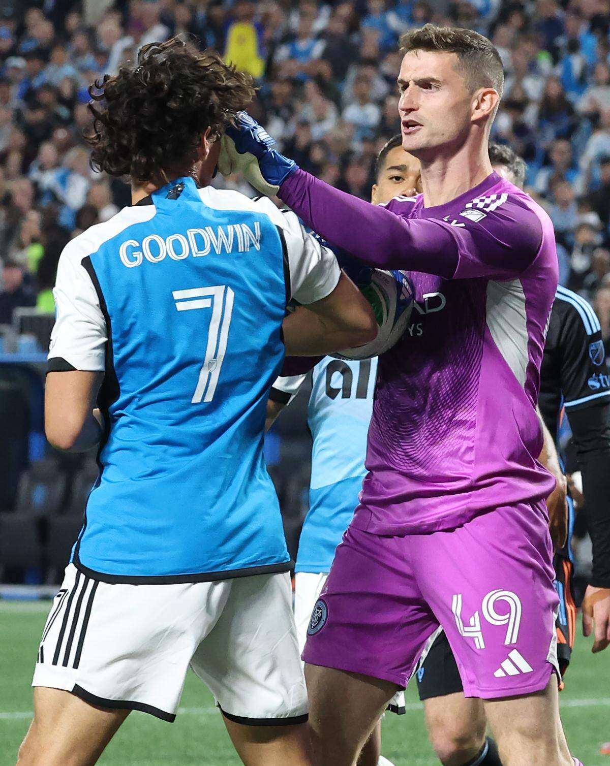 New York City FC goal keeper Matt Freese, right, gets into an altercation with Charlotte FC striker Archie Goodwin, left, during action on Friday, November 7, 2025. The New York City FC defeated Charlotte FC 3-1 in Game 3 of the MLS Playoffs at Bank of America Stadium in Charlotte, NC.