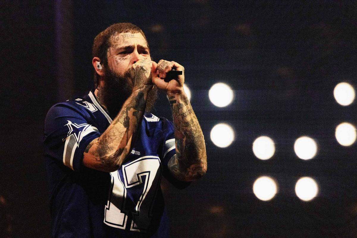 Post Malone performs at PNC Music Pavilion on Monday night.