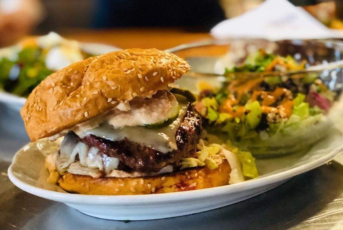 A Kid Cashew lunch special with a Mac Daddy burger and a quinoa-stuffed avocado.