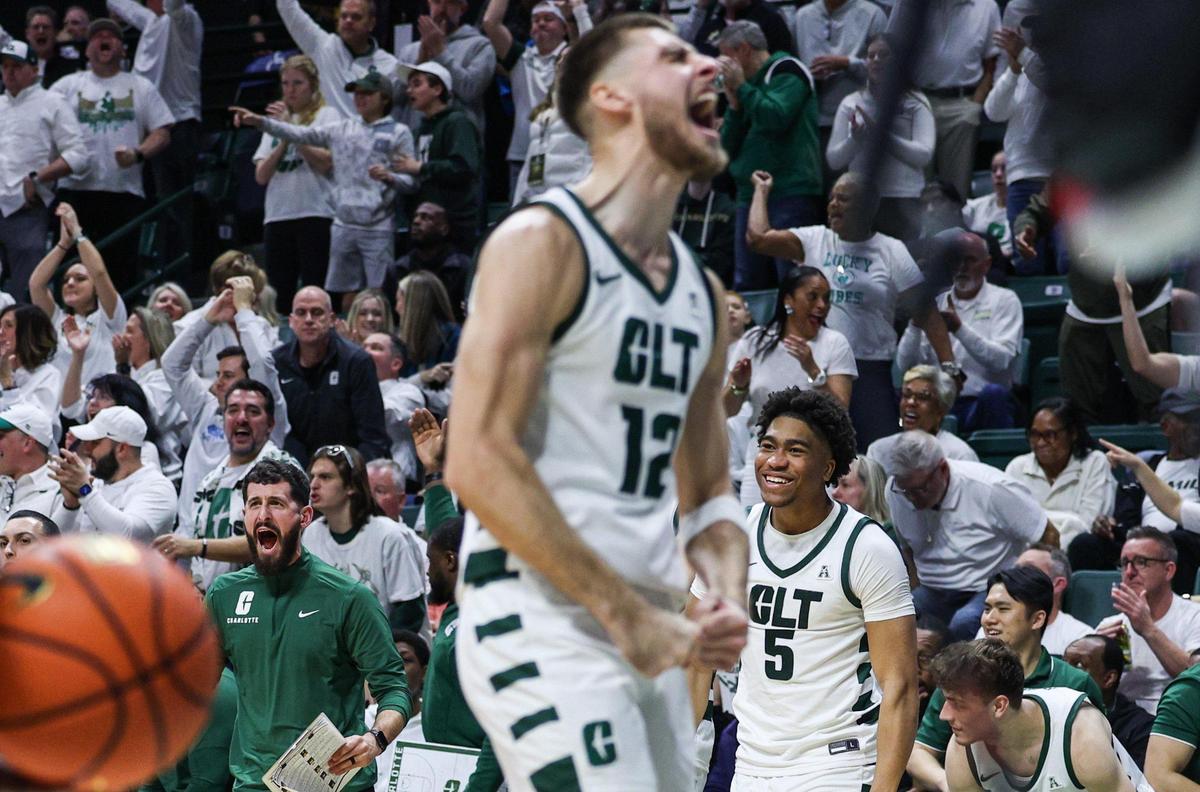 Charlotte 49ers player Jackson Threadgill (12) and the crowd celebrate during Charlotte’s 67-52 win over East Carolina Saturday.