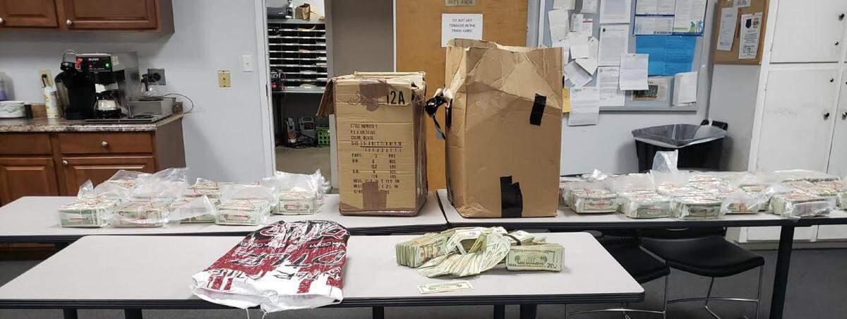 Prosecutors say almost $1 million in cash was found in two boxes and a draw-string bag in Seneca Moore’s truck last May. Now the feds want it. Photo courtesy of the U.S. Attorney’s Office in Charlotte.