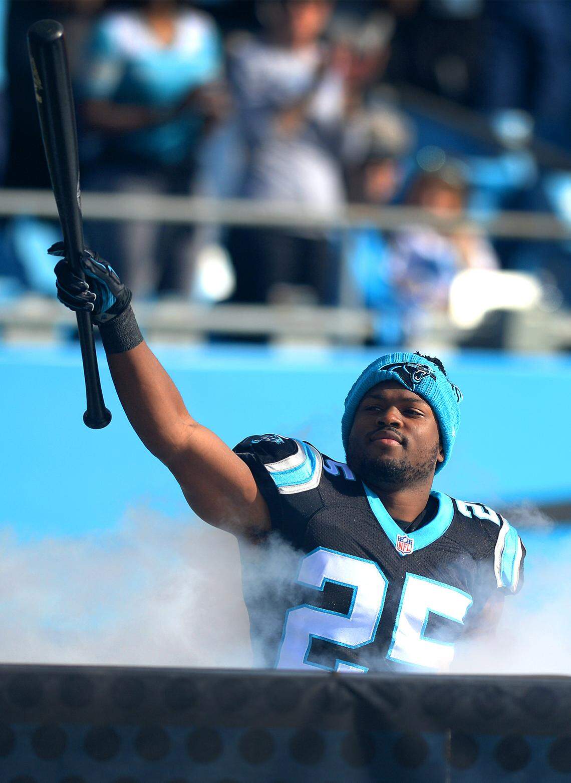 Carolina Panthers cornerback Bene Benwikere raises a baseball bat into the air on Dec.13, 2015, before the Panthers defeated the Falcons. The bat would play a bigger role the following week, against the New York Giants.