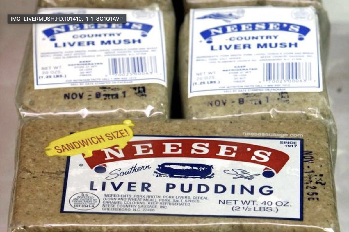 A close-up photograph of three refrigerated packages of Neese’s sausage products. Two smaller packages in the background are labeled ‘NEESE’S COUNTRY LIVER MUSH.’ A large package in the foreground is labeled ‘NEESE’S Southern Style LIVER PUDDING’ and has a yellow ‘SANDWICH SIZE!’ sticker adhered to the packaging.