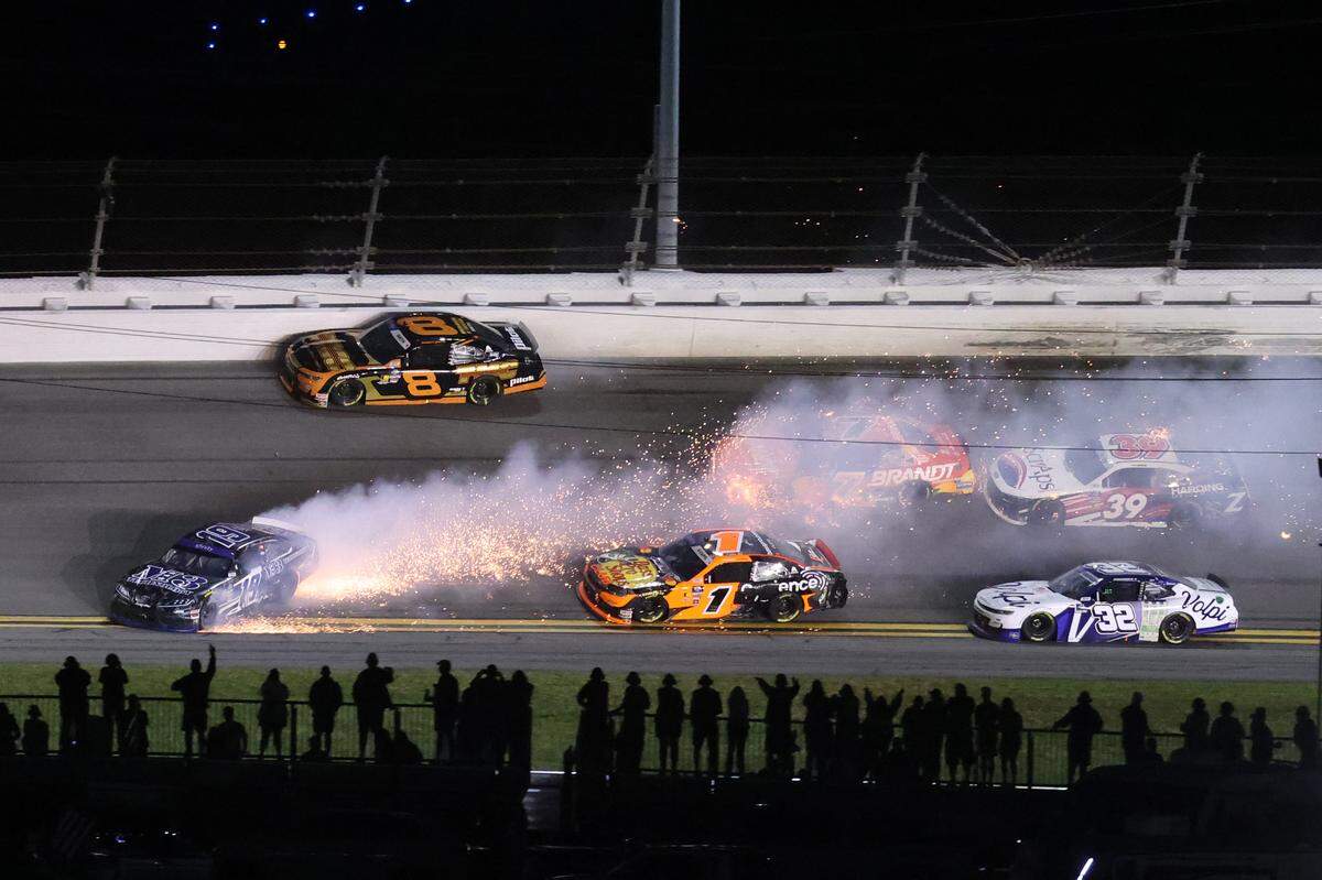 Feb 15, 2025; Daytona Beach, Florida, USA; Xfinity Series driver Justin Bonsignore (19) wrecks in front of the field during the United Rentals 300 at Daytona International Speedway. Mandatory Credit: Mark J. Rebilas-Imagn Images