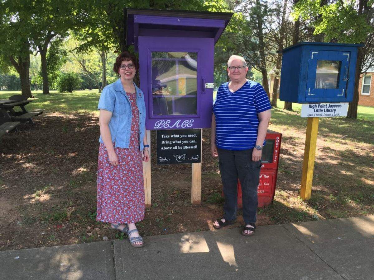 Heidi Minor, left, and Frances Browne, visited the Little Free Food Pantry to stock items in High Point. The pantry recently celebrated its three-year anniversary.