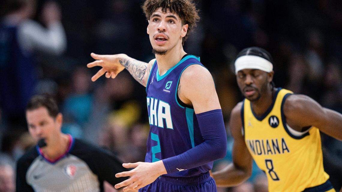 Charlotte Hornets guard LaMelo Ball (2) reacts after making a 3-point basket against the Indiana Pacers during the first half of an NBA basketball game in Charlotte, N.C., Friday, Nov. 19, 2021. (AP Photo/Jacob Kupferman)