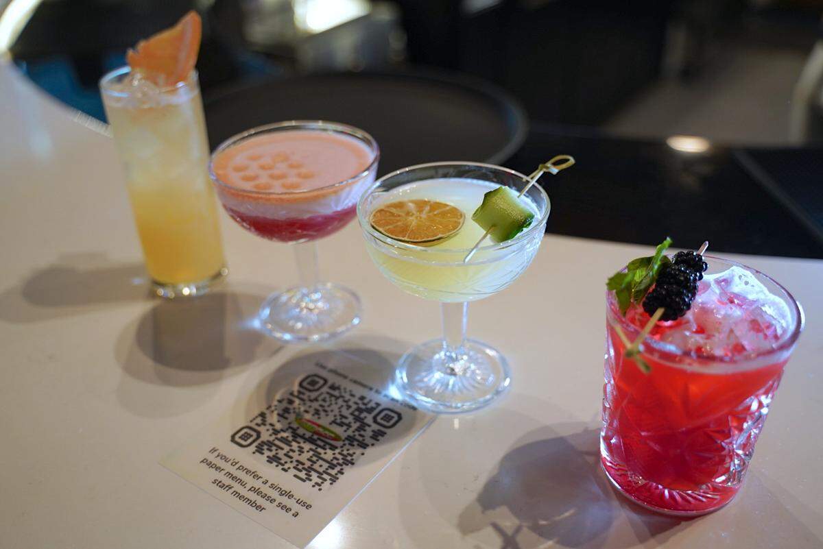 Stroke has a themed cocktail menu. Shown here, from left: (1) Bump & Run: Ketel One Botanical, House-made honey grapefruit lemon syrup, Topo Chico sparkling mineral water; (2) Oscar Bravo, 1000 Piers Gin, housemade bitter blueberry syrup, egg white, Angostura mist; (3) Cart Path Only; Citadelle Gin housemade cucumber kiwi lime syrup; (4) Inside the Leather, Bulleit Bourbon, housemade blackberry lemon syrup, muddled fresh mint.