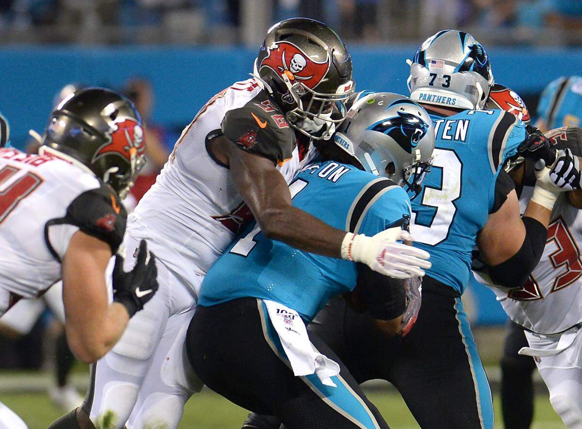 Buccaneers linebacker Shaquil Barrett (left) enters Week 6 not just as the NFL’s sack leader, but on pace for a historic total.