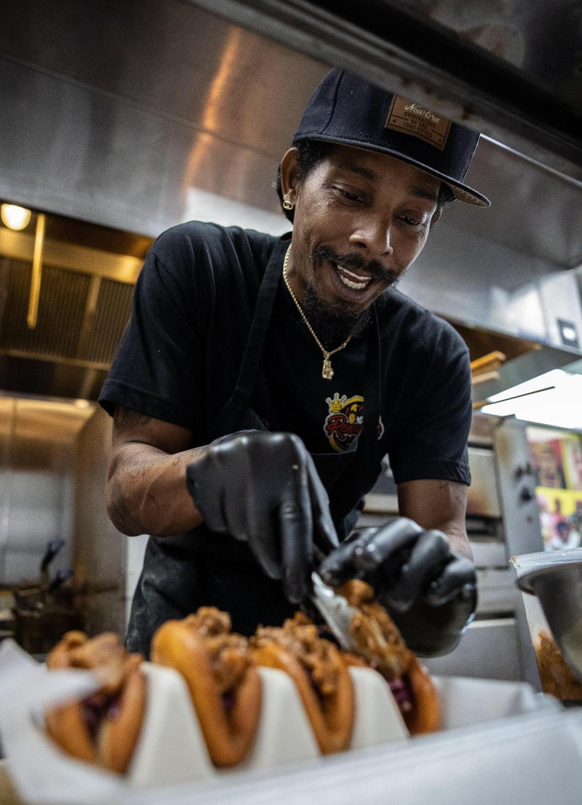 Renaldo Norris prepares food at his restaurant, Renaldo’s Culinary Experience. Norris’s latest concept, Ann Marie’s, is recently opened in Northwest Charlotte.