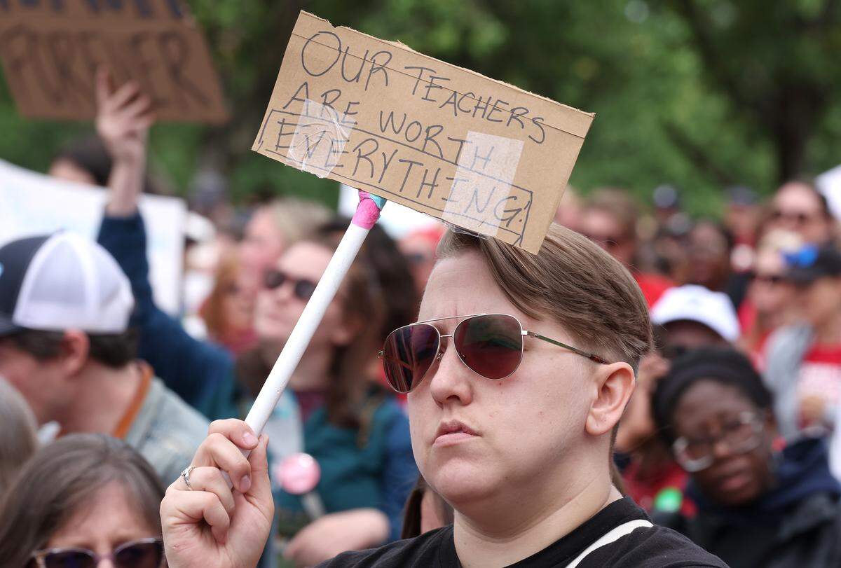 Signs, signs, signs were everywhere as teachers rallied at the Government Complex in Raleigh.