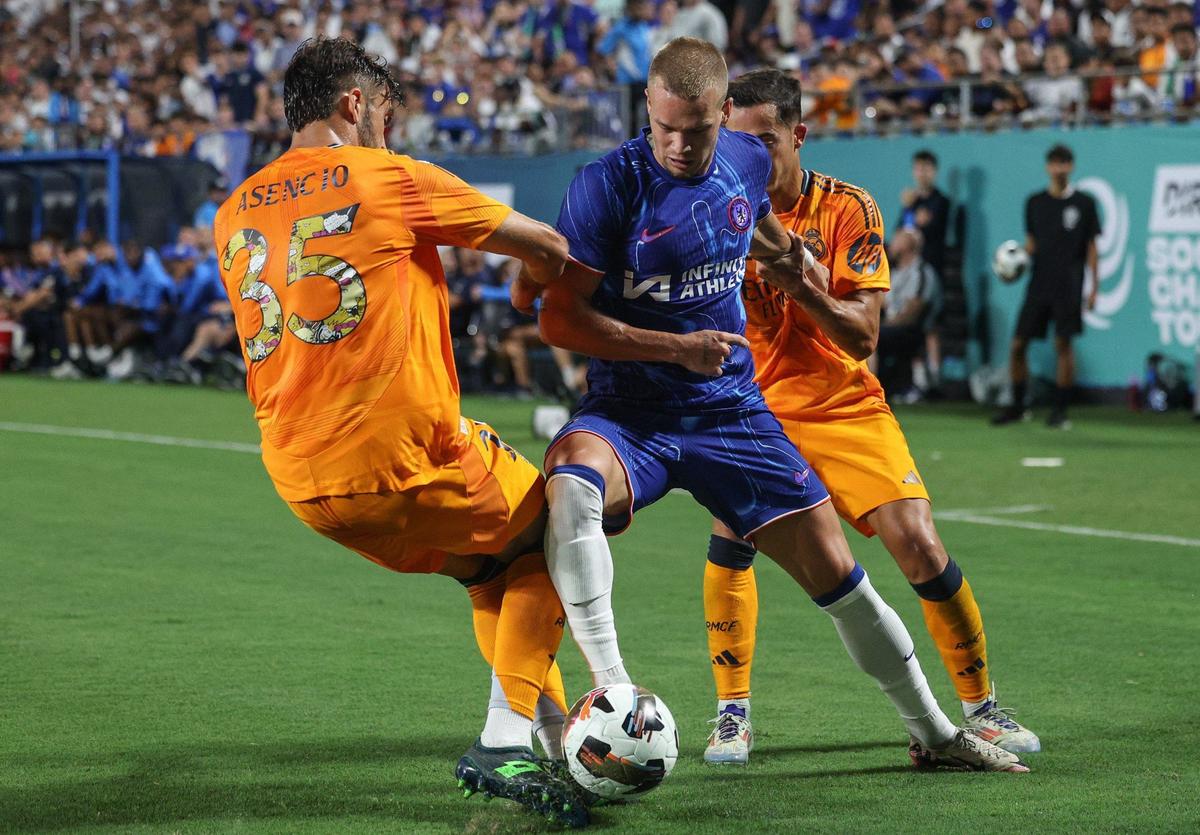 Chelsea’s Misha Mudryk, center, fights for possession of the ball against two Real Madrid players during a soccer “friendly” in 2024 in Charlotte. Real Madrid will return to the Queen City in 2025 for the FIFA Club World Cup.