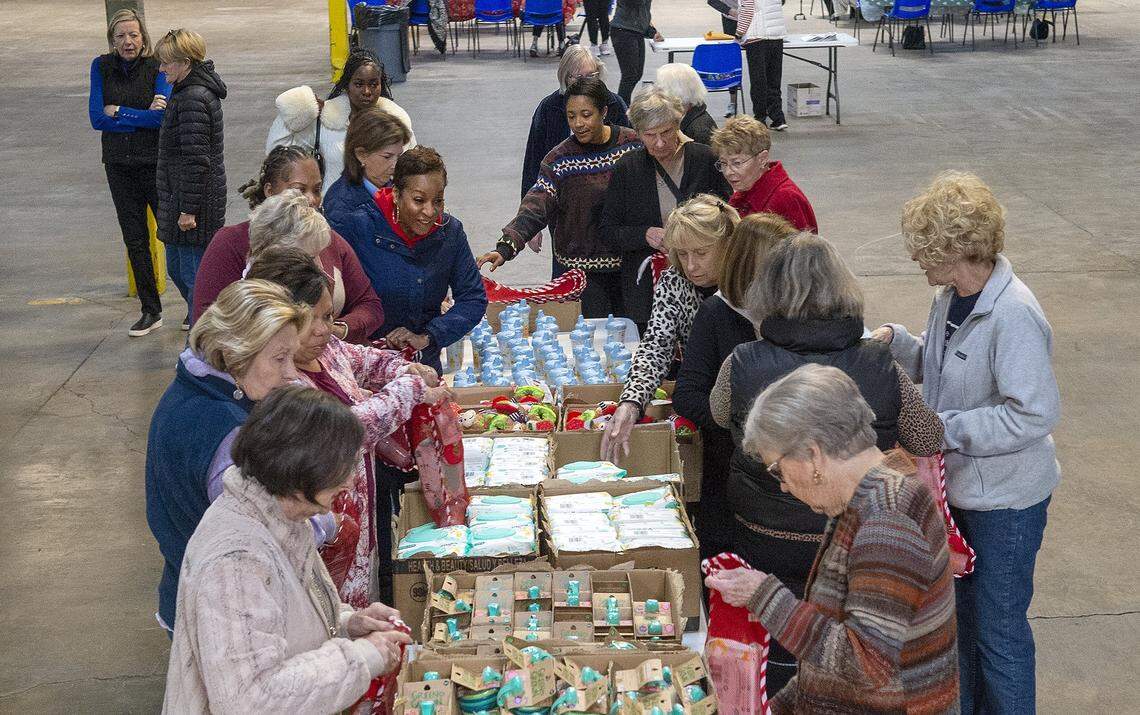 About 40 members of the Salvation Army's Women's Auxiliary group stuffed stockings with toys and other items for their Angel Tree program. The Salvation Army of Greater Charlotte's Angel Tree program matches children in need with anonymous donors who buy them presents for Christmas and provides senior citizens with gifts. In cases where donors didn't step up, Charlotte Observer readers cover the expense by giving to the Empty Stocking Fund. The Observer has sponsored the Empty Stocking Fund since about 1920. We photographed the stocking stuffers on Tuesday, Nov. 18, 2025.