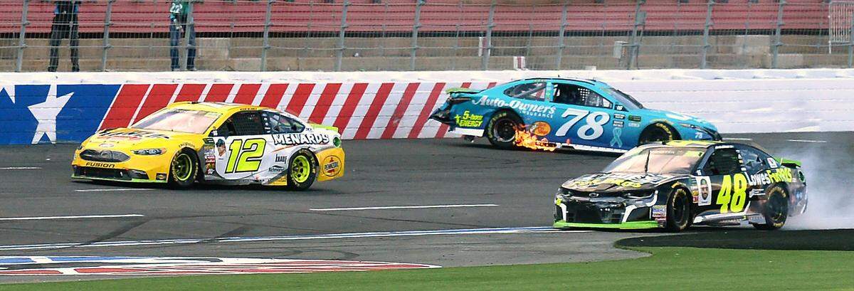 Martin Truex Jr. (78) and Jimmie Johnson (48) were involved in a last-lap collision during the 2018 Bank of America ROVAL 400 at Charlotte Motor Speedway that knocked Johnson out of the NASCAR Cup Series playoffs and gifted Ryan Blaney the win.