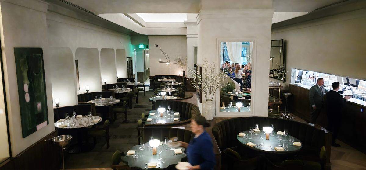 The kitchen is in view of the dining room at Albertine.