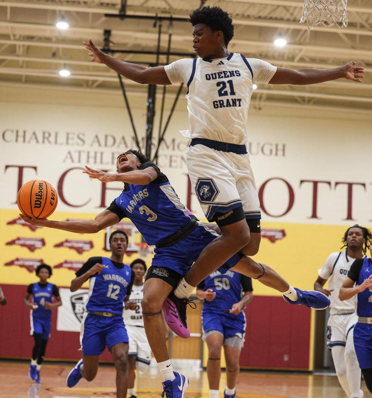 Indian Land’s Michael Jones, left, tries to shoot over Queens Grant’s Chase Smith during the Martin Luther King, Jr. Tournament at West Charlotte High School in Charlotte, NC on Saturday, January 18, 2025.