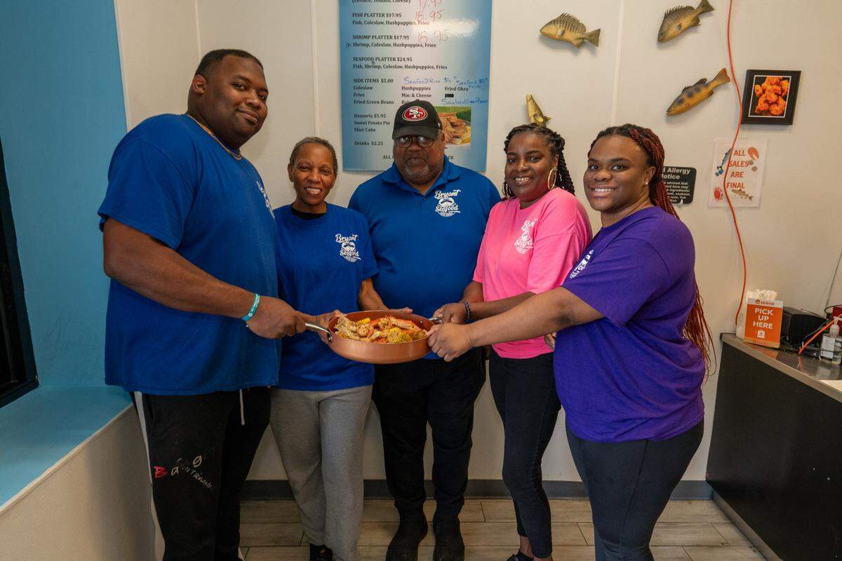 L.J. Bryant, Momma Naomi Bryant, Big Wayne Bryant, Aunt Suzie and Jazzy da Niece at Bryant Seafood Market.