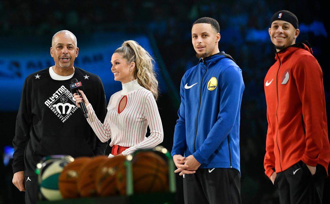 During the 2019 NBA All-Star Weekend in Charlotte, Dell Curry (left) was interviewed while Steph Curry (second from right) and Seth Curry (right) looked on.
