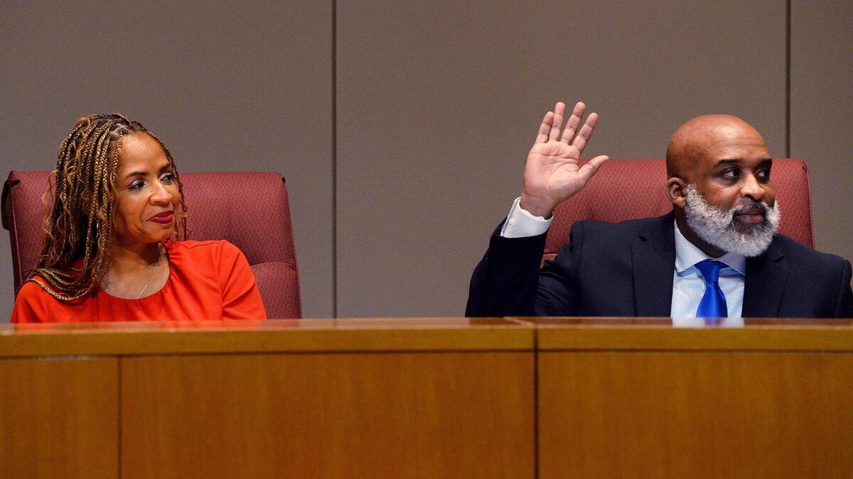 CMS Board Vice Chair Dee Rankin, right, has helped to lead the creation of a new free speech policy for the district. Pictured to his left in this 2023 file photo is Chair Stephanie Sneed.
