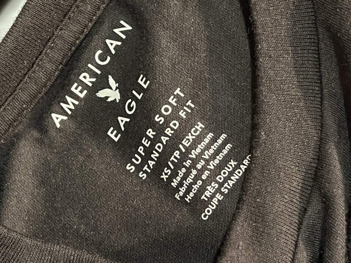 MIAMI, FLORIDA - APRIL 04: A tag on an American Eagle shirt indicates it was manufactured in Vietnam on April 04, 2025 in Miami, Florida. Shares of American Eagle Outfitters, Inc. AEO fell 17.4% yesterday after U.S. President Donald Trump announced significant new tariffs against global trading partners. U.S. President Donald Trump declared a U.S. economic emergency and announced sweeping tariffs of at least 10%, with rates even higher for 60 countries that have a high trade deficit with the U.S. The tariffs will affect electronics, automobiles, clothing and shoes, wines and spirits, and Swiss watches.  (Photo by Joe Raedle/Getty Images)