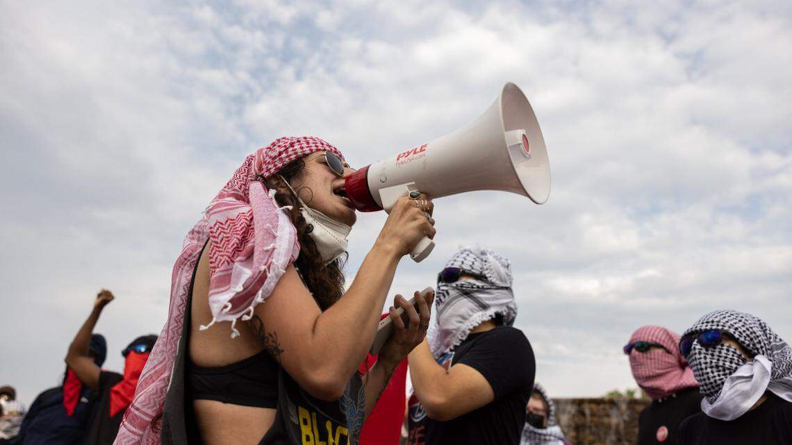 UNC Charlotte students and local activists march through campus during a rally for solidarity with Gaza and to protest student oppression at UNC Charlotte in Charlotte, N.C., on Tuesday, May 7, 2024.