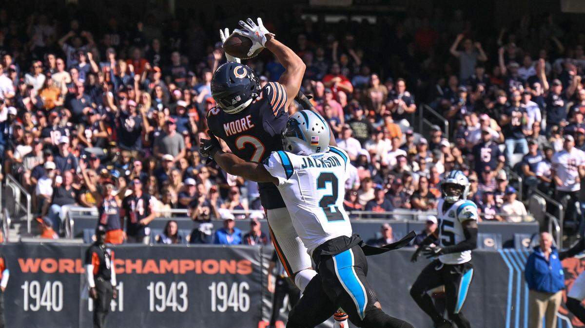 Chicago Bears wide receiver DJ Moore (2) catches a pass in the end zone against the Carolina Panthers during the second quarter Sunday afternoon at Soldier Field. Acquired by Chicago in the Bryce Young trade, Moore scored two TDs against his former team, leading Chicago to a 36-10 win.