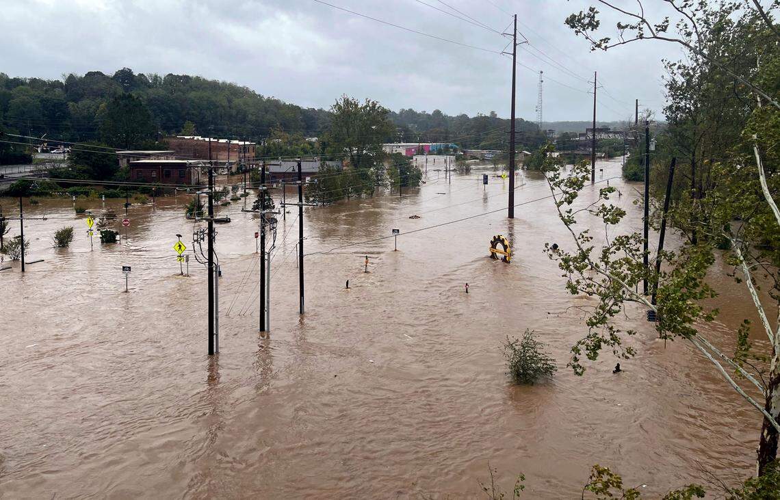 The French Broad River reached over 16 feet by 11 am on Sept. 27, flooding most of the River Arts District, seen here from the Haywood Road bridge.