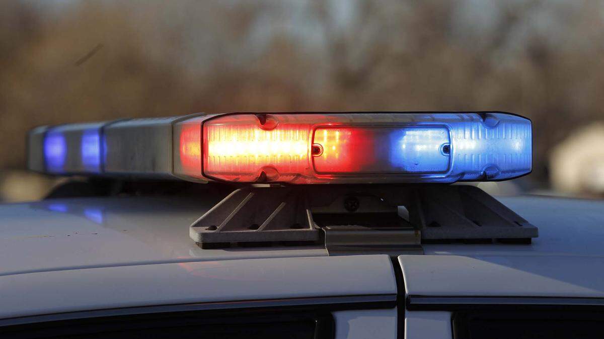 A police car turns on its lights at Patrol South Friday. (Jan. 18, 2013)