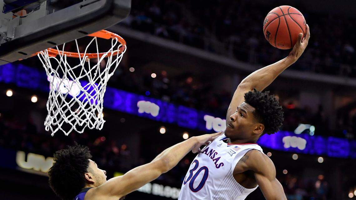KU’s Ochai Agbaji charged down the lane, grabbed this alley-oop inbounds pass and threw down what had to be the dunk of the tournament over TCU’ s Micah Peaby during the second half of Friday’s semifinal game at the Big 12 Conference Tournament in Kansas City. KU beat TCU, 75-62.