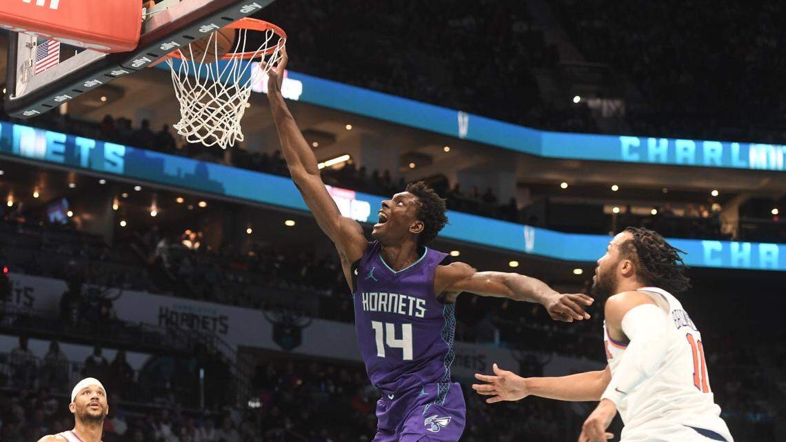 Nov 29, 2024; Charlotte, North Carolina, USA;  Charlotte Hornets forward Moussa Diabate (14) drives in during the second half against the New York Knicks at the Spectrum Center. Mandatory Credit: Sam Sharpe-Imagn Images