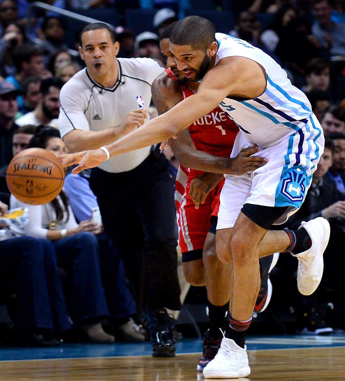 Charlotte Hornets guard Nicolas Batum chases after a loose ball in a game against the Houston Rockets at Spectrum Center on Feb. 9, 2017.