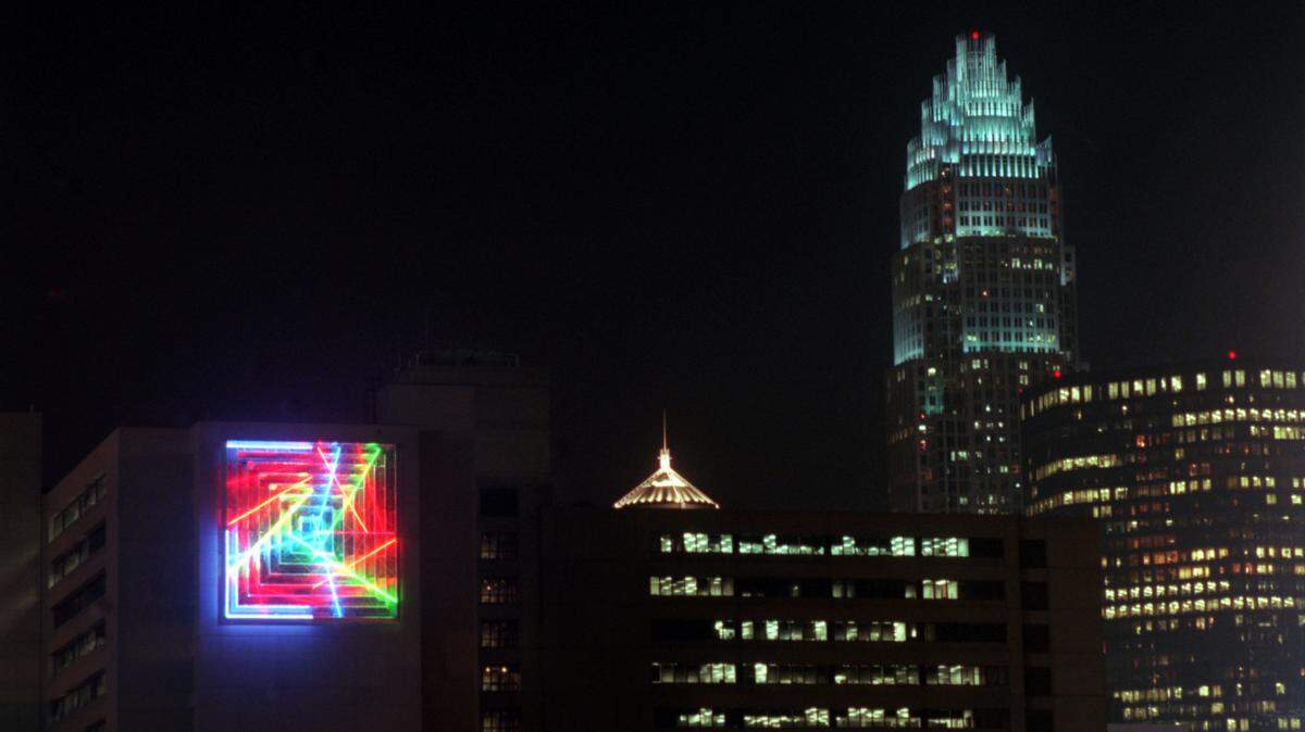 Photo from 1996 by The Charlotte Observer: “Quadrille” installed on what was the Duke Energy building at the time in uptown Charlotte, by artist Michael Hayden.