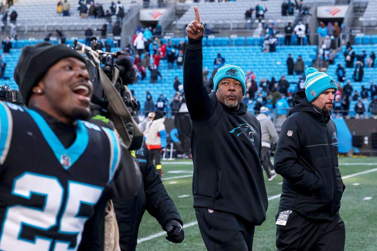 Panthers Head Coach Steve Wilks points toward the stands as he walks off the field after a win over the Lions, 37-23, on Saturday, December 24, 2022.