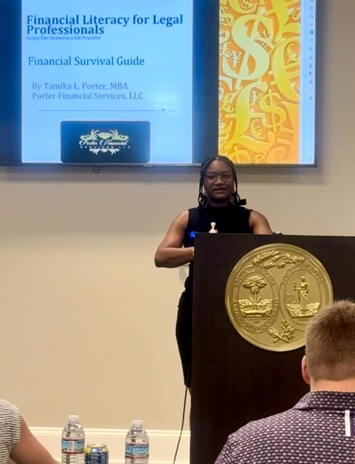 Tamika Porter, of Porter Financial Services LLC, speaks to an audience about her financial services.
