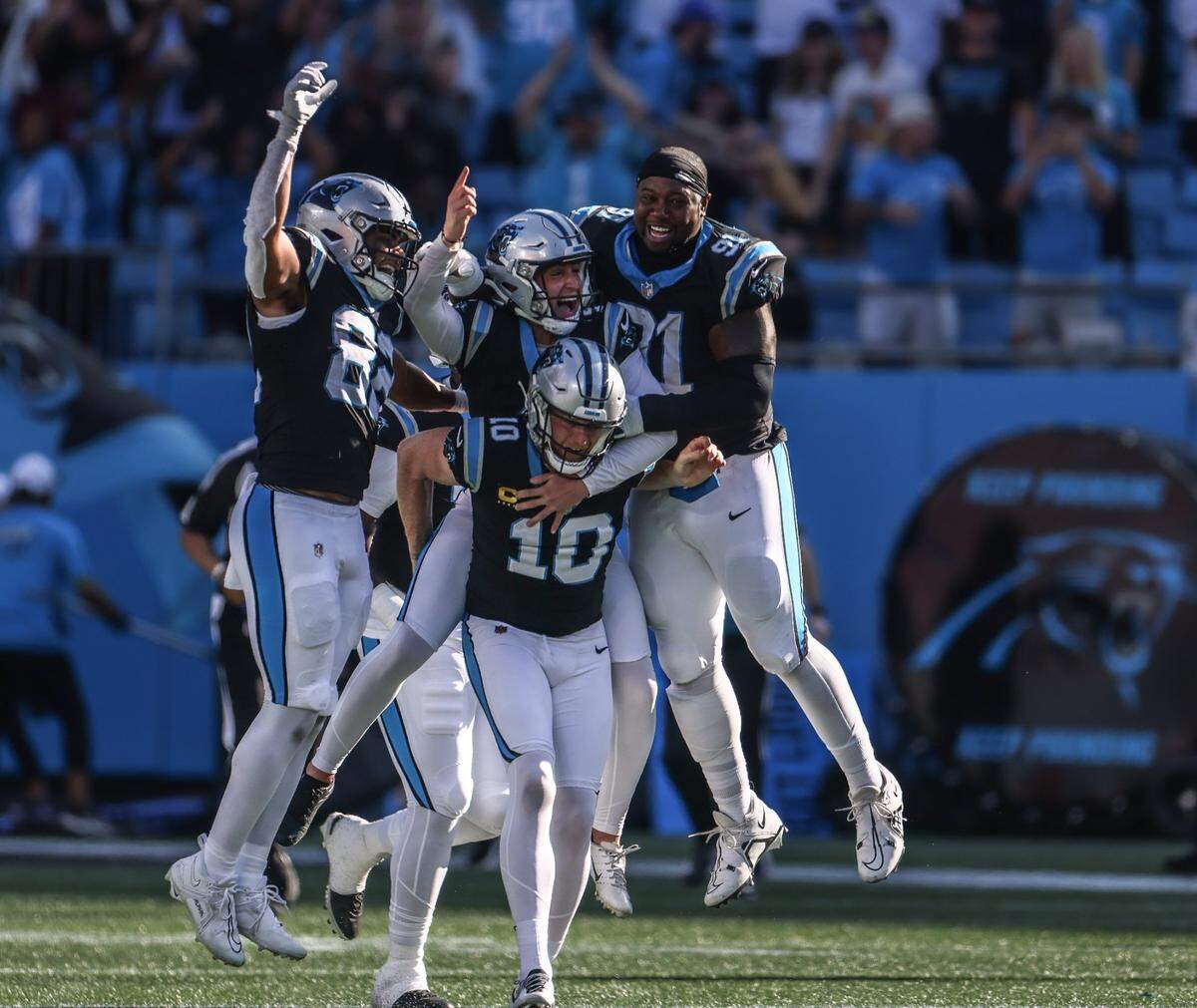 Players celebrate Carolina Panthers place kicker Eddy Pineiro’s game winning field goal at the Bank of America Stadium in Charlotte, N.C., on Sunday, October 29, 2023.
