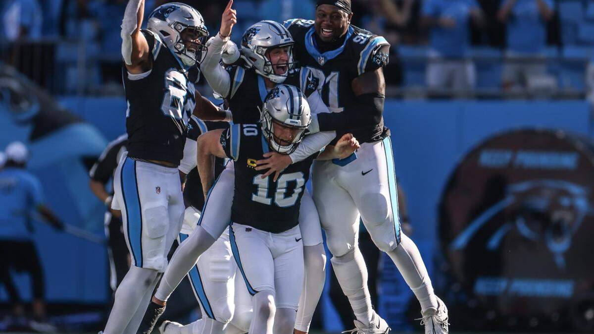 Players celebrate Carolina Panthers place kicker Eddy Pineiro’s game winning field goal at the Bank of America Stadium in Charlotte, N.C., on Sunday, October 29, 2023.