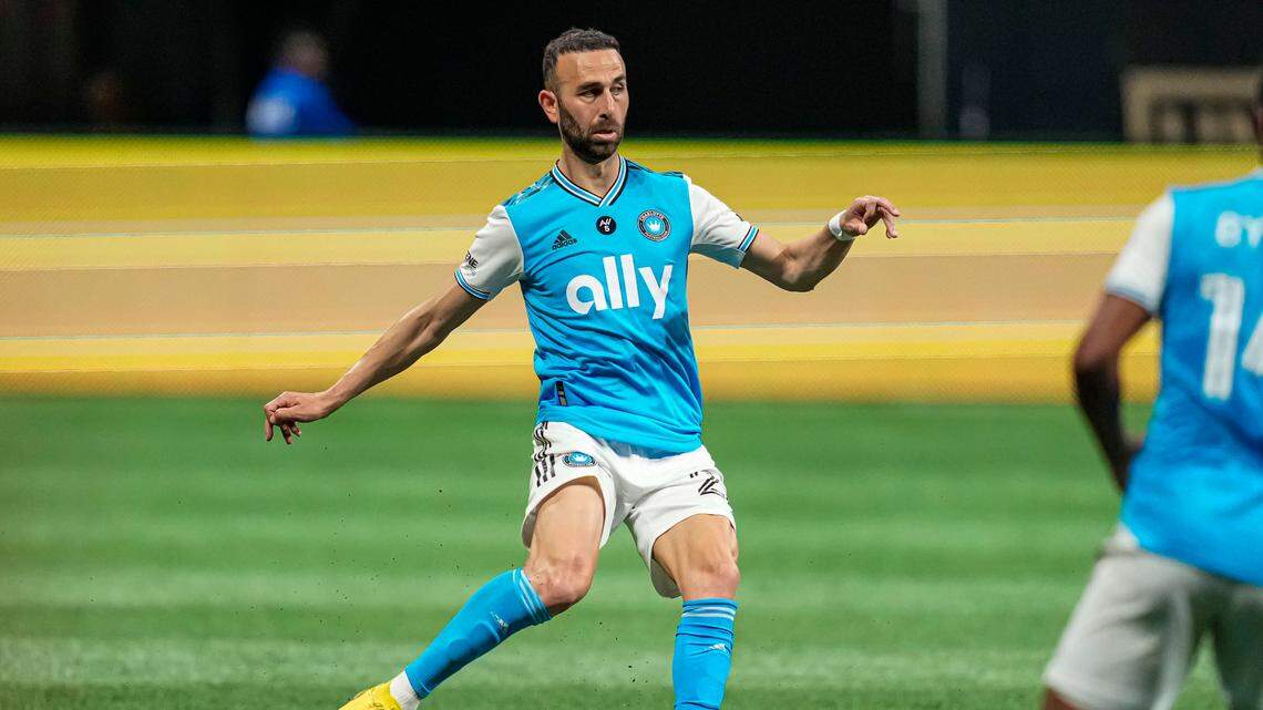 Charlotte FC midfielder Justin Meram (22) kicks the ball against Atlanta United at Mercedes-Benz Stadium. Dale Zanine-USA TODAY Sports