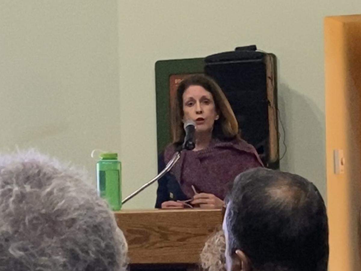 Discovery Place President and CEO Catherine Wilson Horne addresses a packed crowd at Discovery Place Nature Tuesday about plans to demolish and rebuild a bigger museum. The plan has been controversial with neighbors who worry the new museum will be too big for the residential neighborhood.