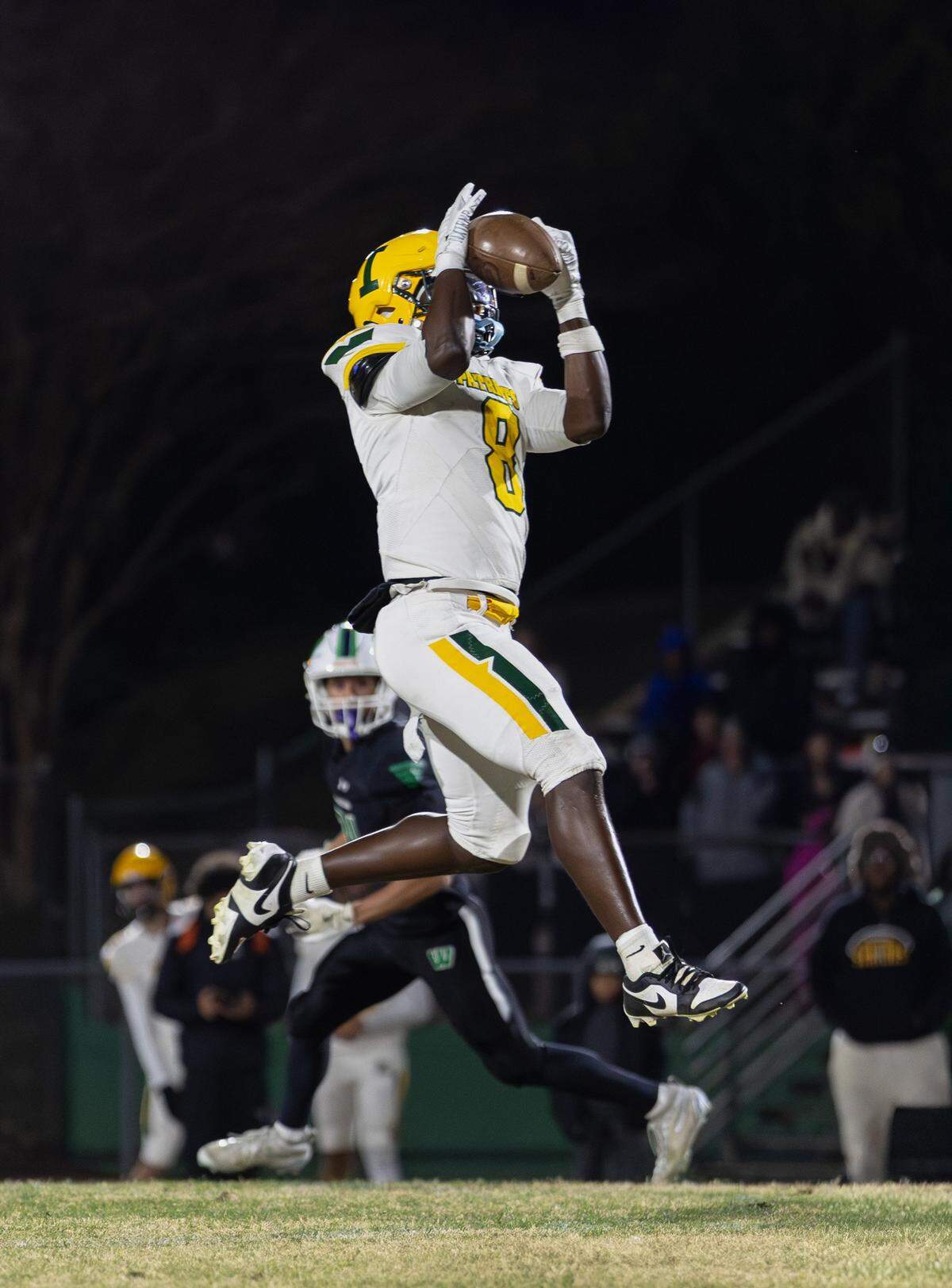 Patriot's wide receiver Prince Young (8) catches the pass for a big gain during second quarter action. Weddington would host Independence in the NCHSAA quarterfinal playoff game Friday, November, 28 2025.