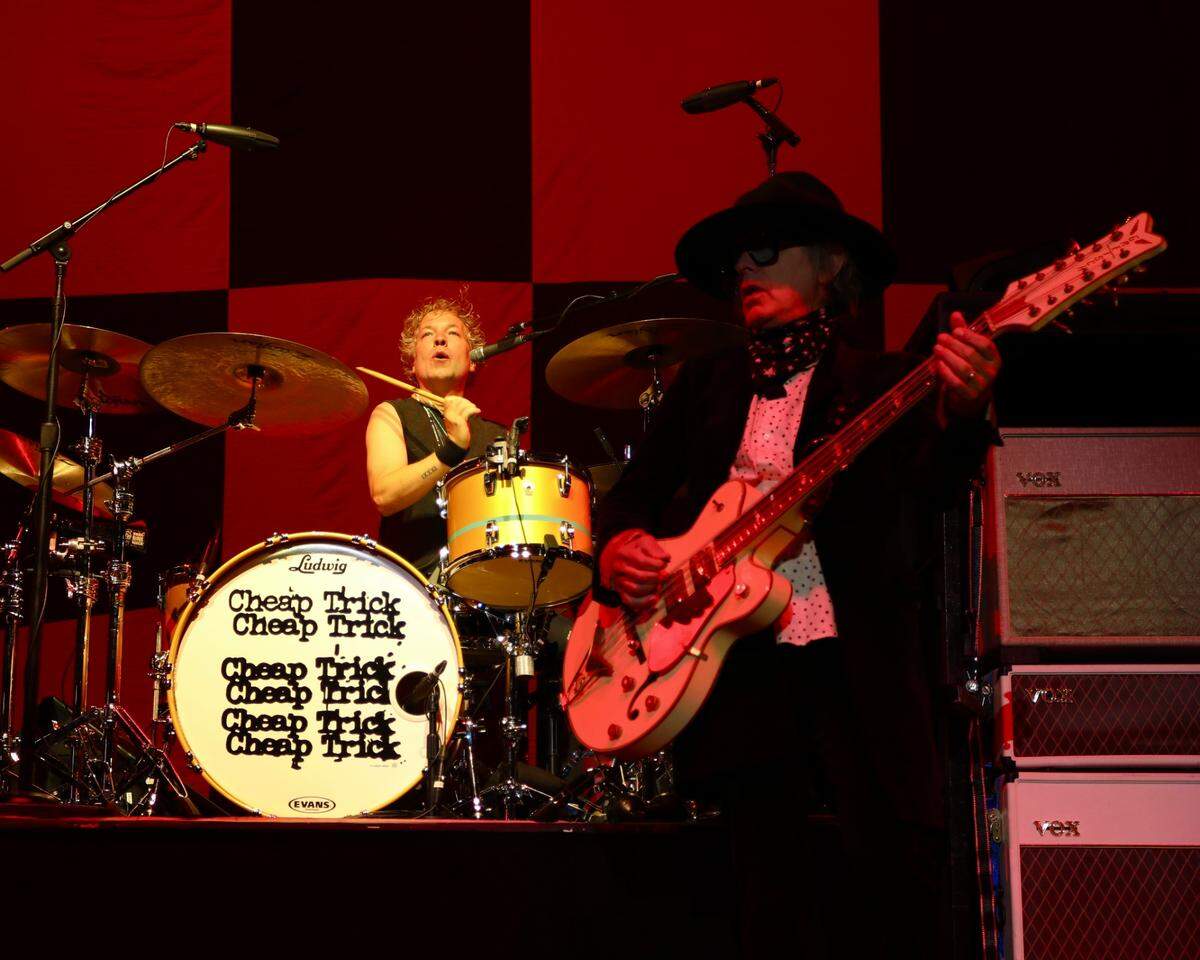 Members of the rock band “Cheap Trick” perform in 2024.