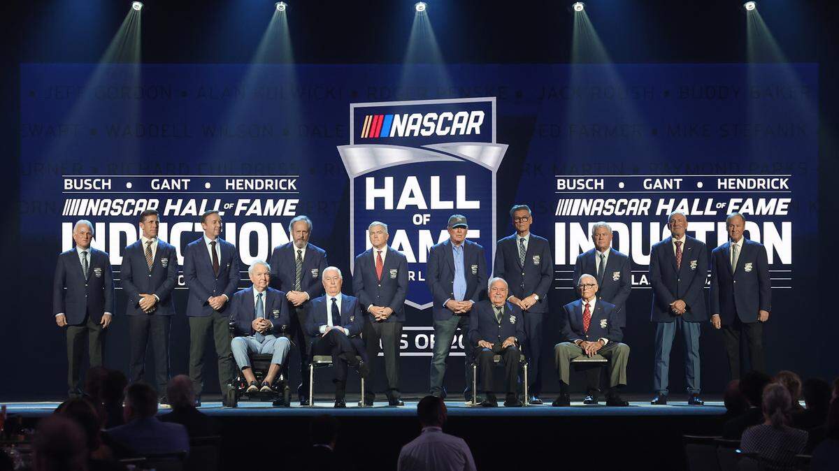 Members of the NASCAR Hall of Fame share the stage for a group photo during the NASCAR Hall of Fame Induction Ceremony at the Charlotte Convention Center in Charlotte, NC on Friday, January 23, 2026.