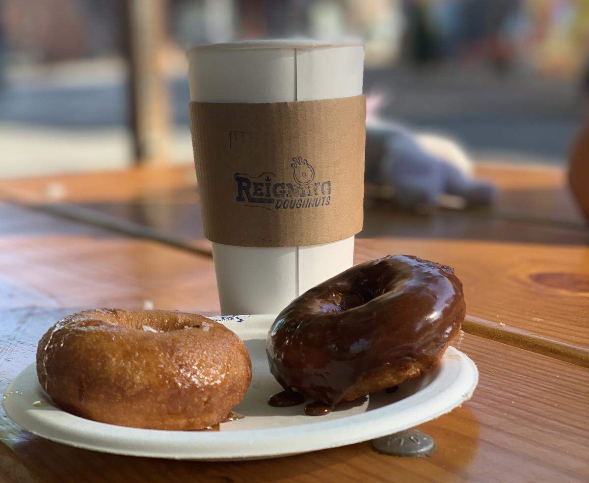 Order doughnuts at the walk-up window at Reigning Doughnuts, then keep warm with a cup of coffee while you wait for them to be made fresh.