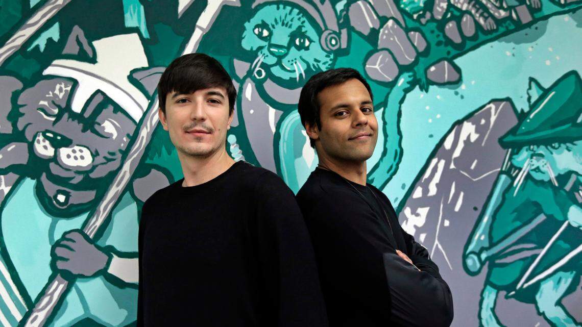 Robinhood co-founder Vlad Teven, left, announced the company’s second round of layoffs since April on Aug. 2. It is also closing its Charlotte office.
